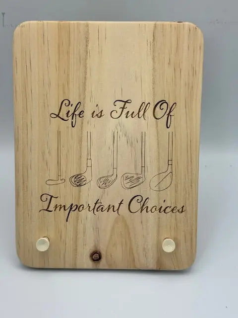 Une planche t’as le Swing grvée du message "life is full of important choices"
